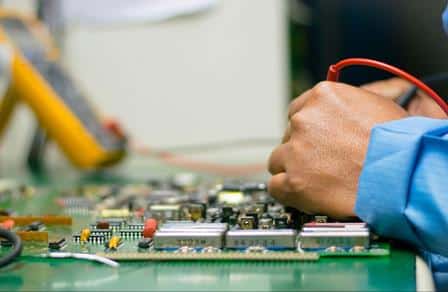 Advanced Diploma of Electrical and Instrumentation - checking voltage on circuit board.